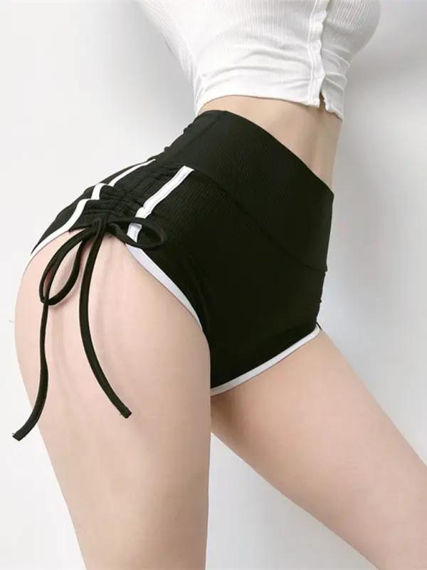 Black lace-up hip-lifting fitness shorts, side view