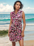Ethnic style summer dress with vibrant pattern on beach