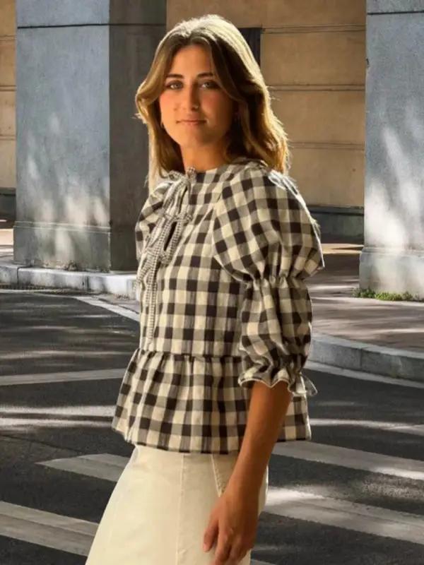 Black and white checkered puff sleeve blouse with tie detail