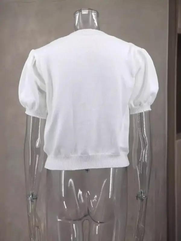 Back view of white short-sleeved sweater on mannequin