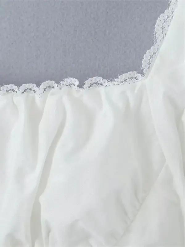 Detail of lace trim on square neck shirt