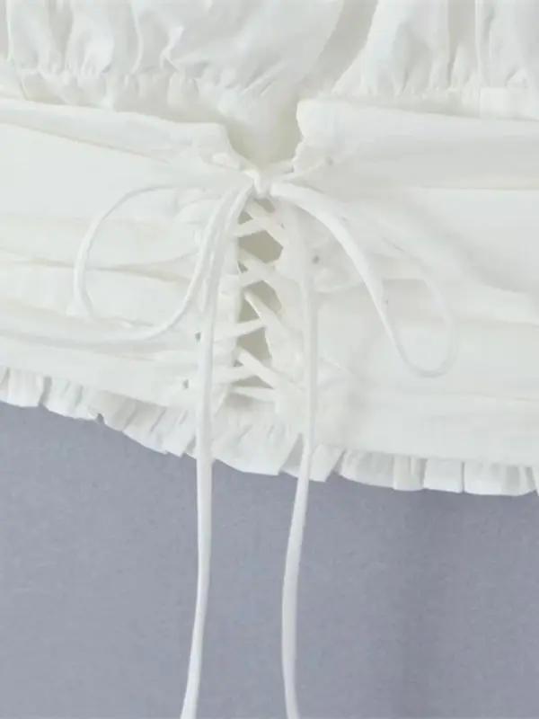 Lace-up detail on super short navel-baring shirt