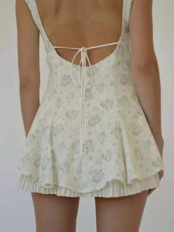 Back detail of floral hem pleated suspender dress