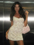 Lace see-through dress with hollow straps, worn by model