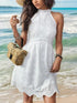 Casual sleeveless halterneck white dress on beach