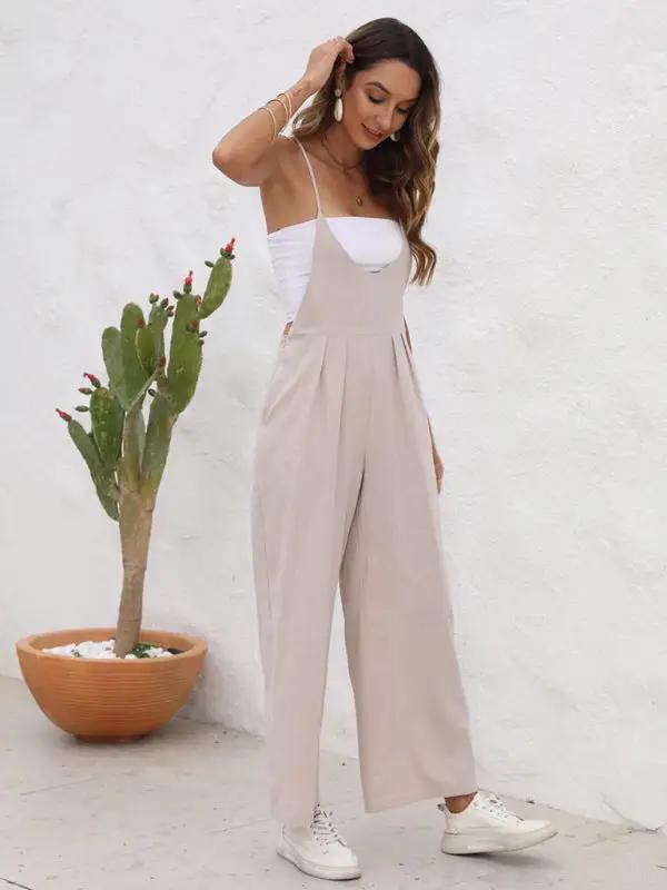 Beige casual suspender trousers, side pose