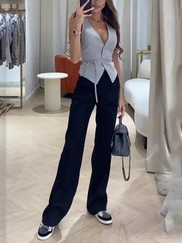 Gray vest and black pants with sneakers