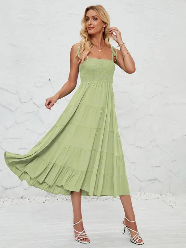 Green sleeveless long suspender dress front view