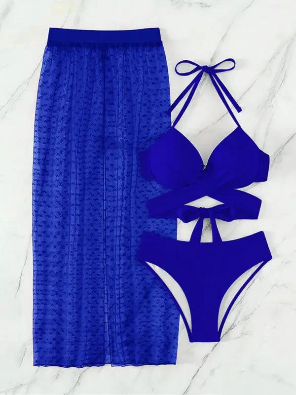 Blue bikini set with mesh skirt on marble background