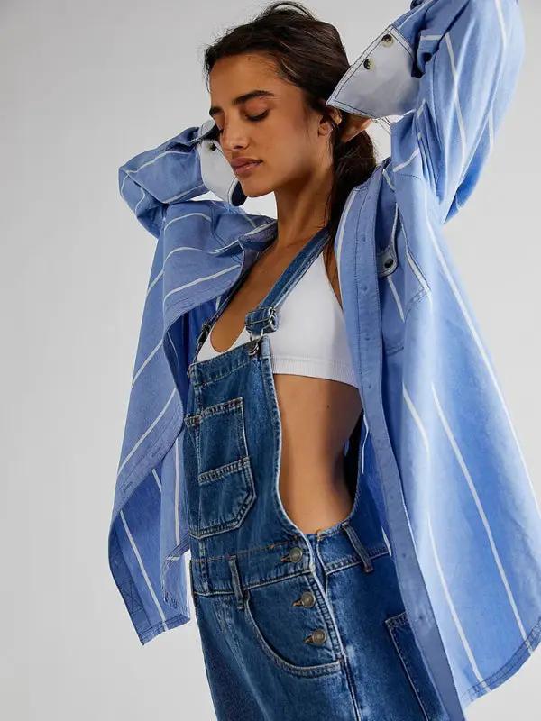 Blue denim overalls with side cutout design