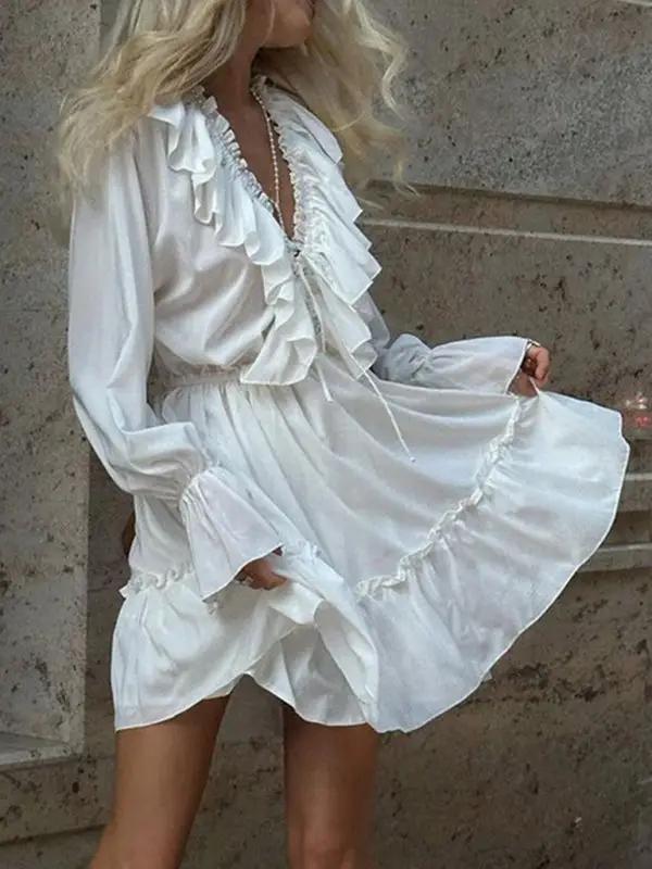Smocked waist white dress with ruffled design