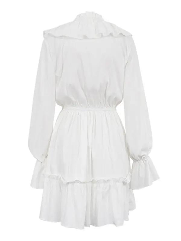 Back view of white dress with smocked waist and ruffles