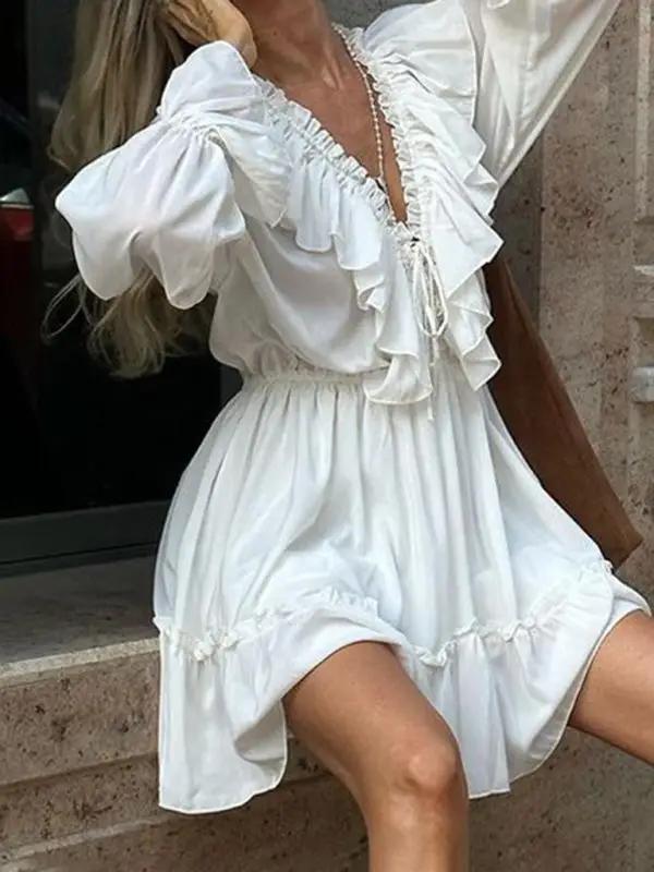 Elegant white dress with ruffled V-neck and sleeves