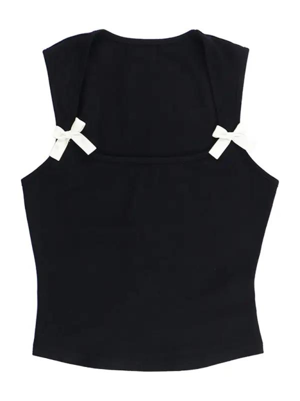 Black vest with white bows, front view