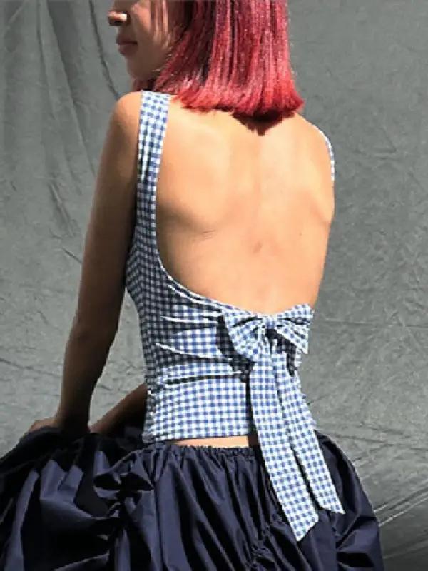 Back view of houndstooth vest worn with bow strap