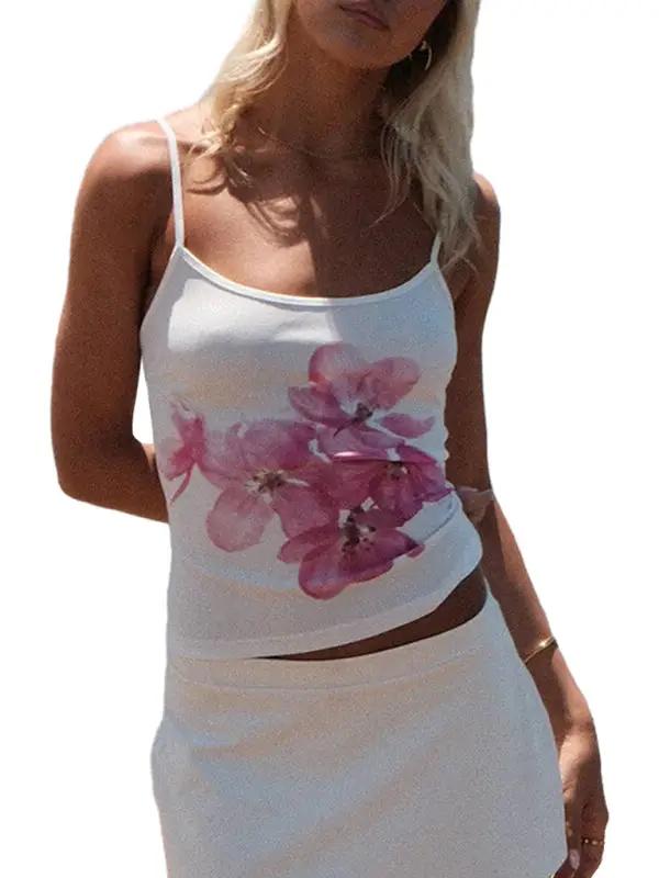 White vest with pink floral design and white skirt