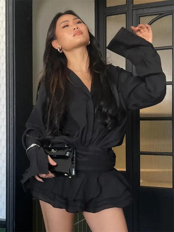 Black V-neck shirt dress with ruffles and handbag