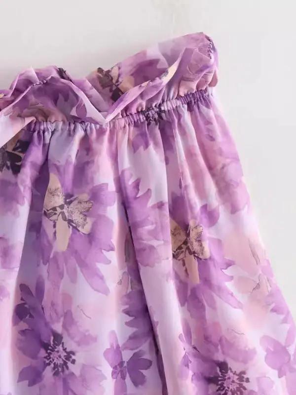 Side view of purple flower one shoulder shirt top