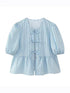 Light blue striped puff sleeve lace-up top, front view