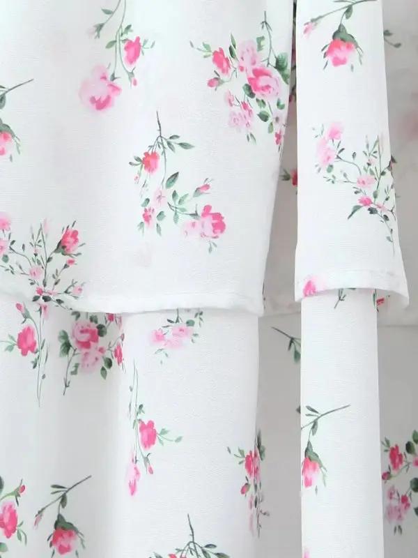 Floral pattern close-up on layered suspender dress