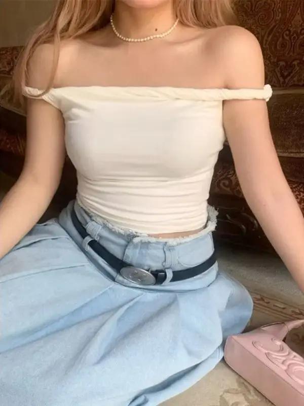 Model wearing off-shoulder beige slim T-shirt with jeans