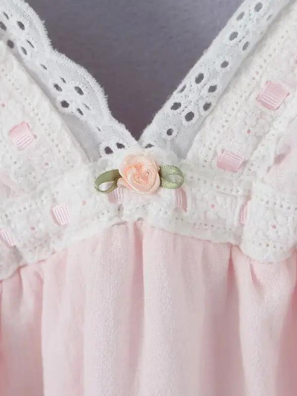 Lace detail with floral accent on pink dress
