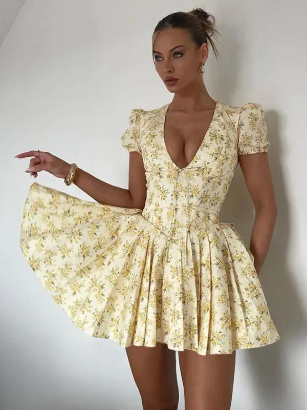 Model wearing deep V floral dress with slim waist