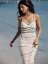 Elegant knitted hollow suspender dress by the beach