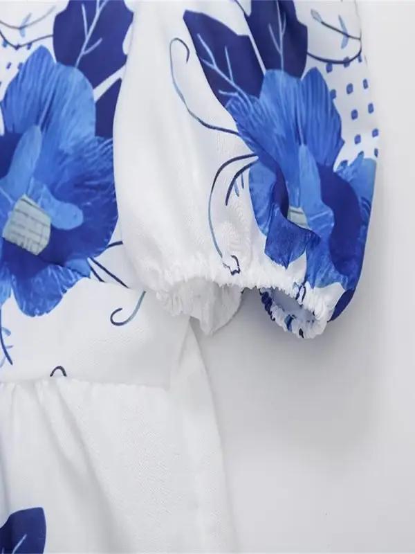 Sleeve detail of floral print V-neck blouse
