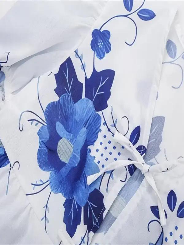 Floral pattern detail on V-neck blouse
