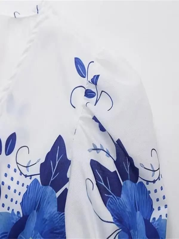 Close-up of floral print on V-neck blouse