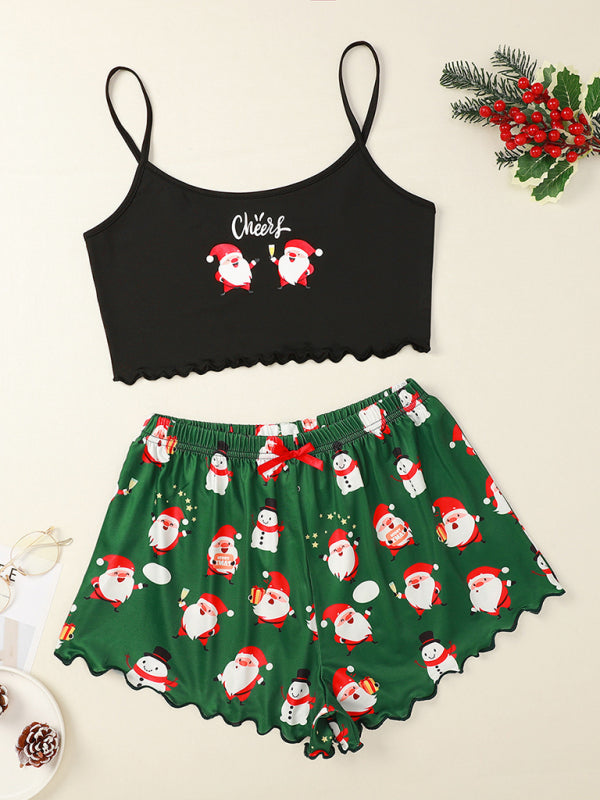 Black Cheers sleeveless top with green Santa print shorts