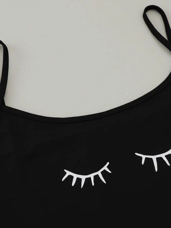 Black camisole top with eyelash print detail