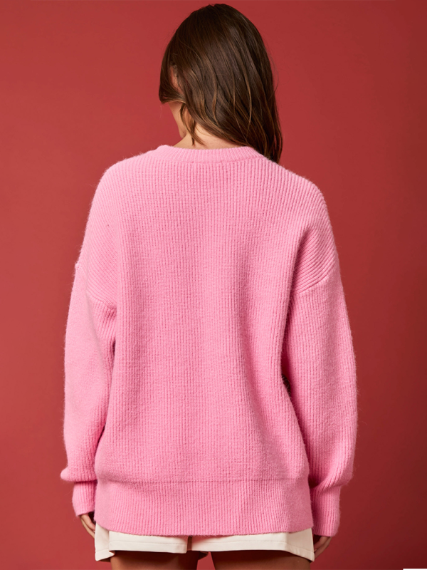 Back view of pink Christmas embroidered sweater.