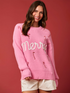 Pink Christmas sweater with &