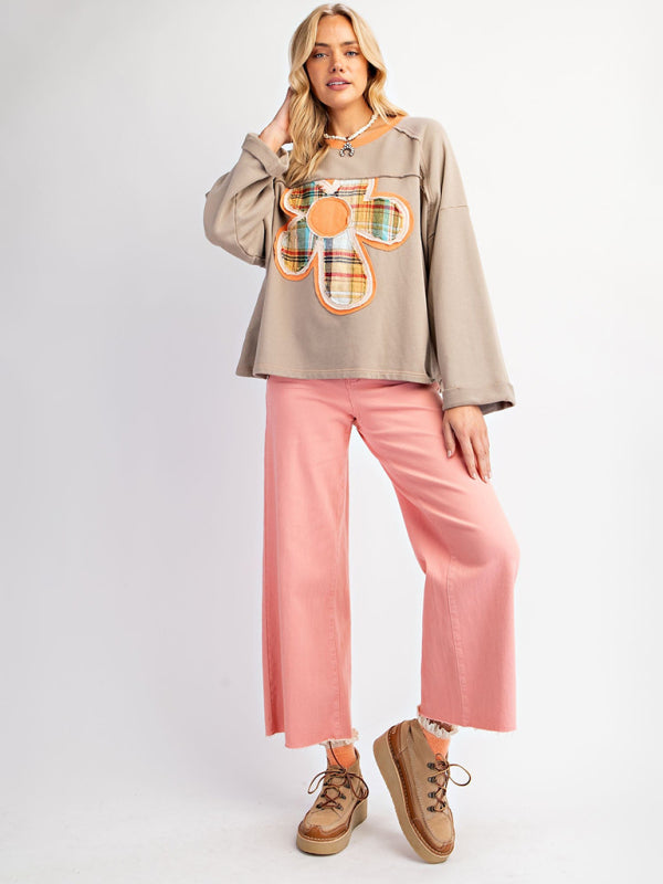 Gray floral patch top with pink pants and sneakers