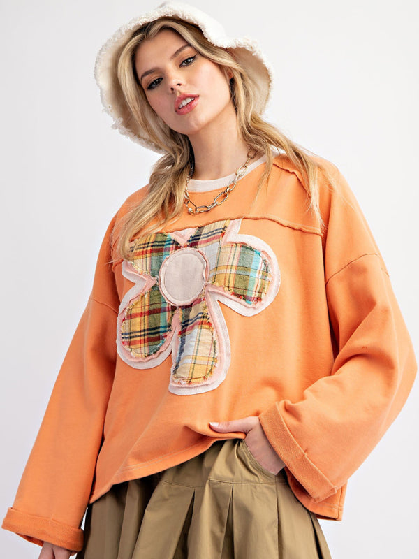 Orange floral patch top with khaki skirt, front view