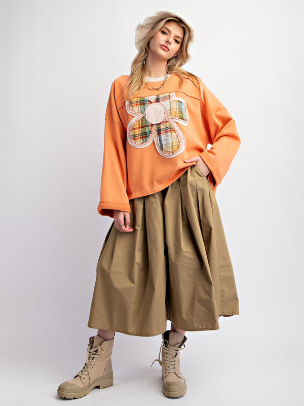 Orange floral patch top with khaki skirt and boots