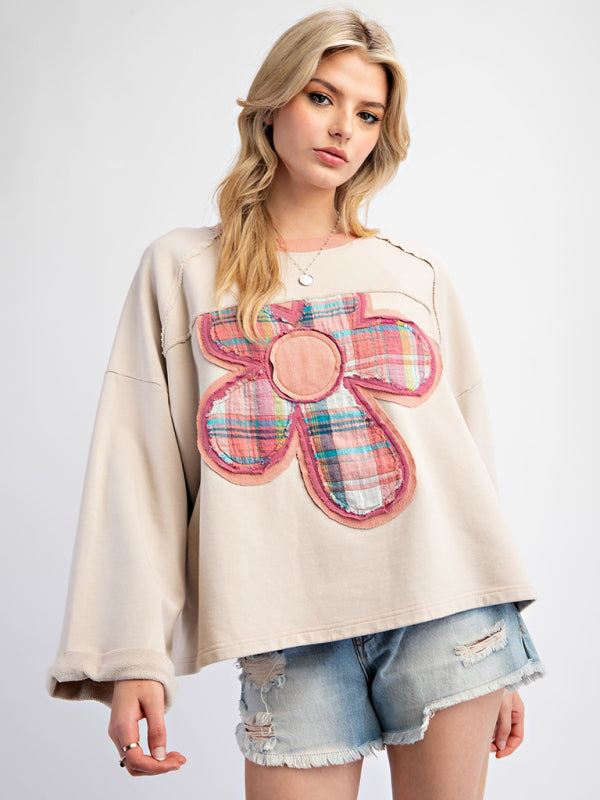 Beige floral patch top with denim shorts, front view