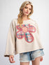 Beige floral patch top with denim shorts, front view