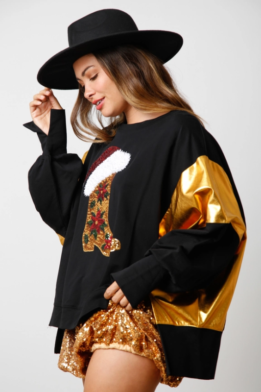 Side view of black sequin Christmas sweatshirt and hat