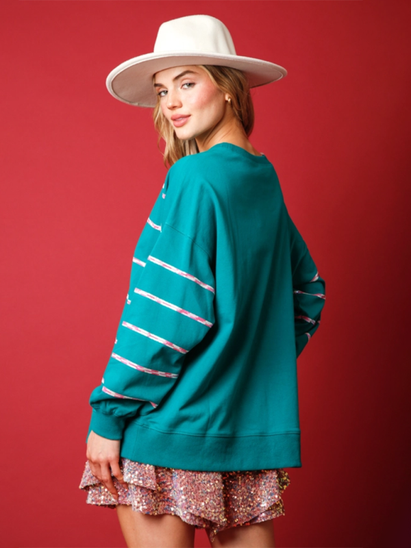 Back view of teal Santa Claus sequin sweatshirt.