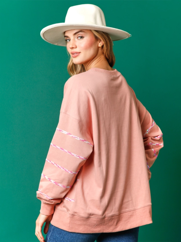 Back view of pink striped Santa Claus sweatshirt.