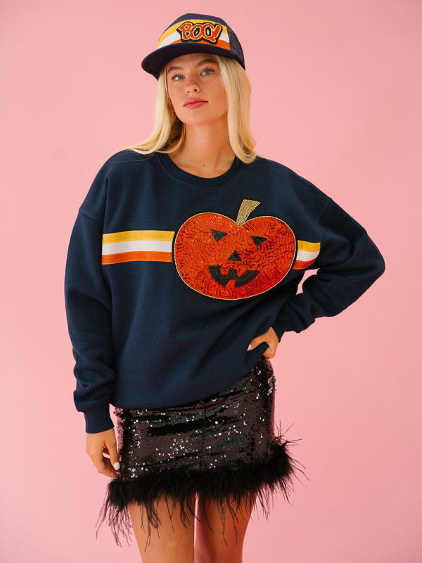 Model wearing navy pumpkin sweatshirt, Halloween casual