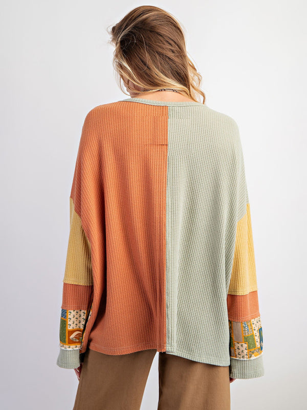 Back view of green and orange contrast print waffle top.