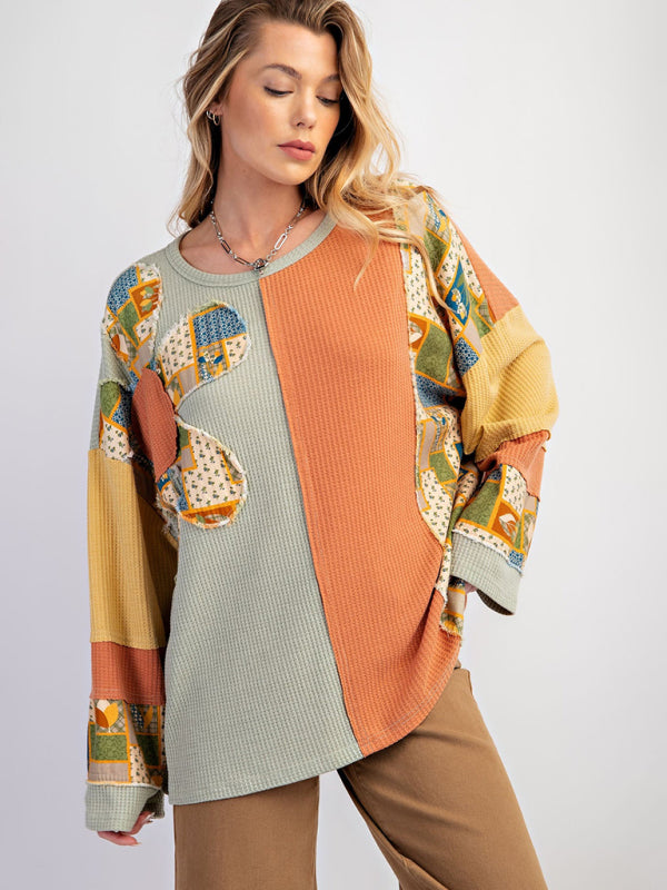 Model wearing green and orange contrast print waffle top.