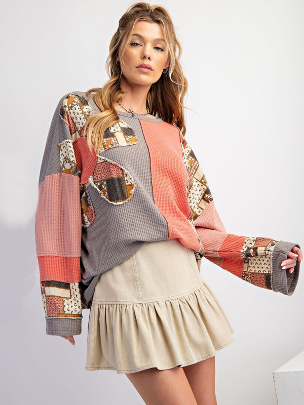 Contrast print waffle top in pink and gray with skirt.