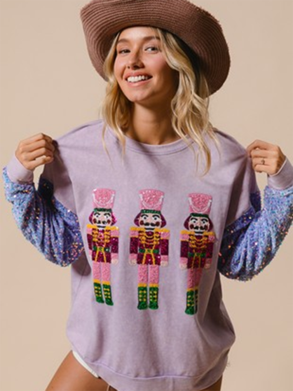 Purple nutcracker sweater with sequin sleeves and hat