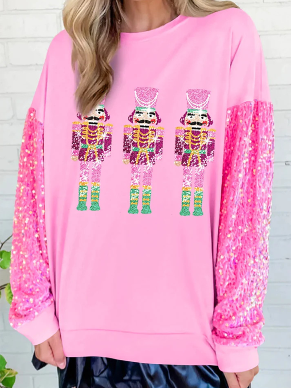 Pink sweater with nutcracker design and sequin sleeves