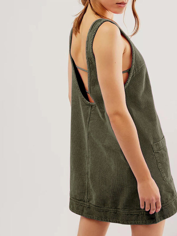 Side view of green corduroy sleeveless vest dress